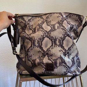 Authentic Snake 🐍 Print Dooney & Bourke with leather tassels and strap.
